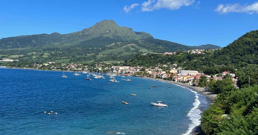Ocean inlet with town and hills